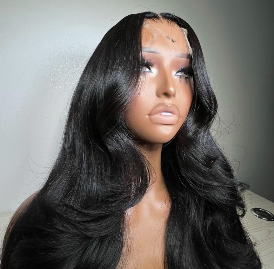 Stunning 13x4 wavy wig featuring soft, luxurious curls that cascade beautifully, perfect for adding volume and style to any look. This high-quality lace front wig offers a natural hairline and is designed for comfort and breathability, making it an ideal choice for everyday wear or special occasions